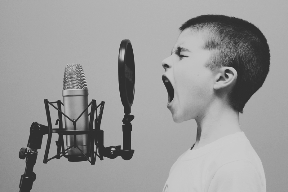 Boy Singing into Rode Microphone in Studio