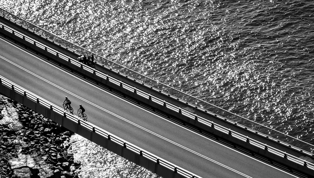 Two cyclists crossing the Sea Cliff Bridge Wollongong